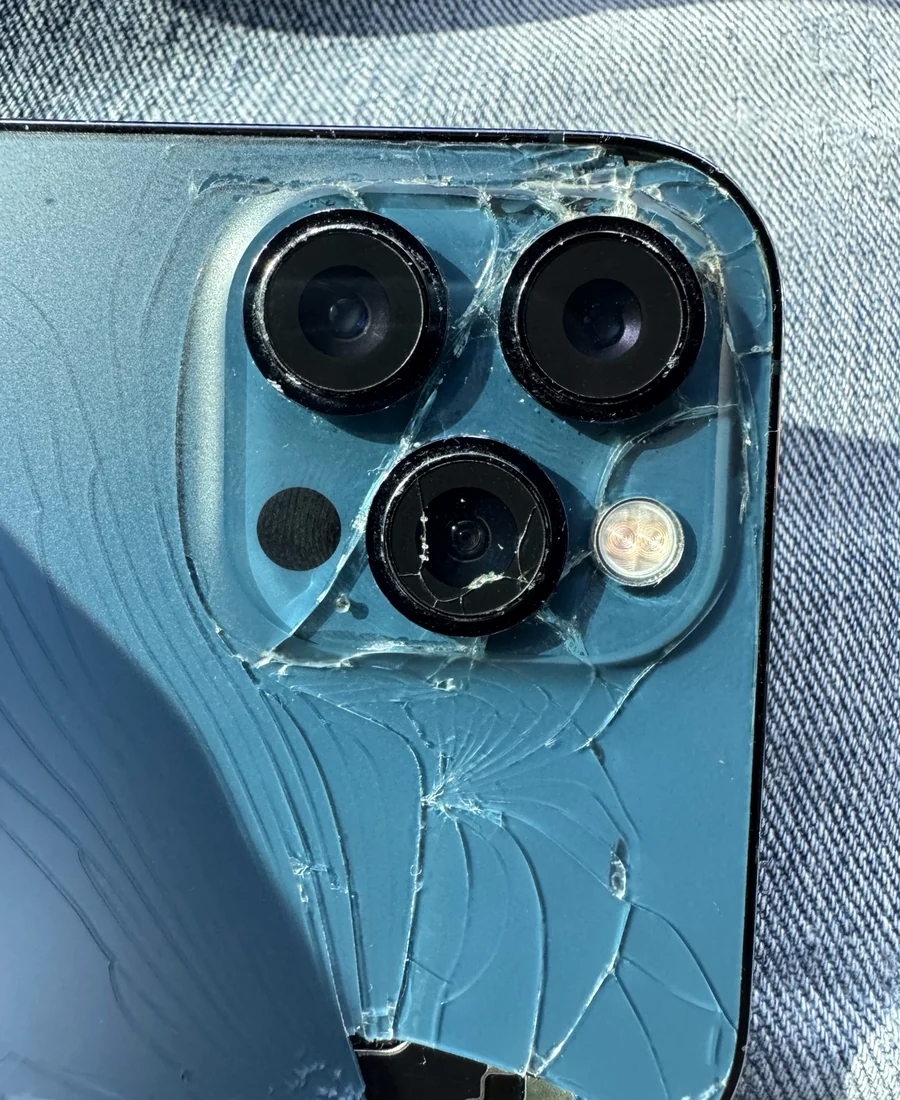Close-up of damaged iPhone Pro camera area